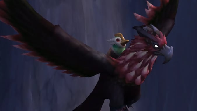 A duckling seated upon a red and brown hawk.